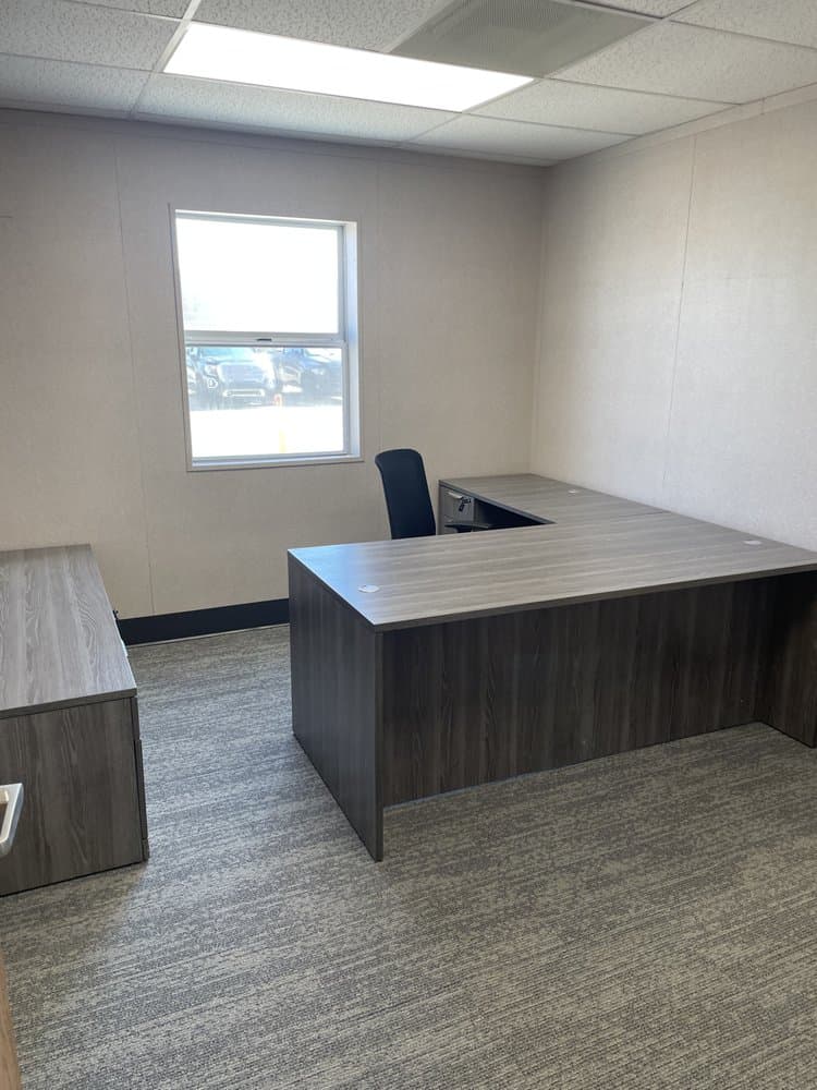 An L-shaped desk with drawers