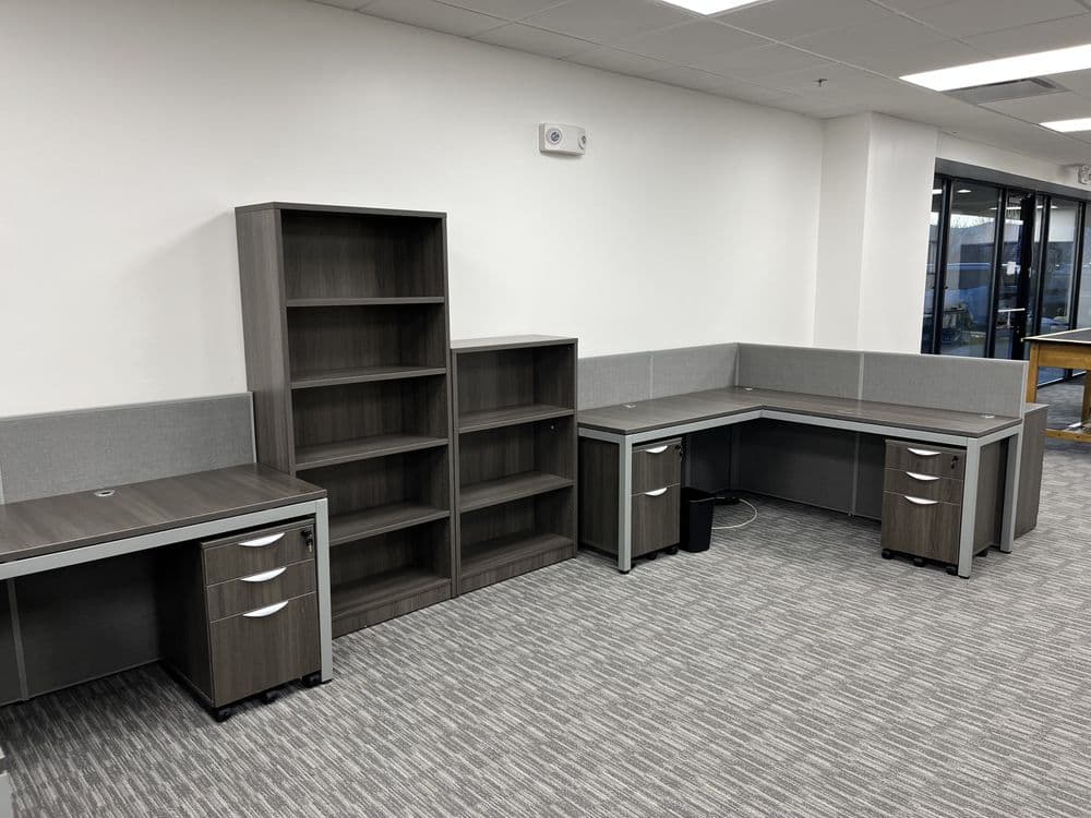 An L-shaped desk with shelves