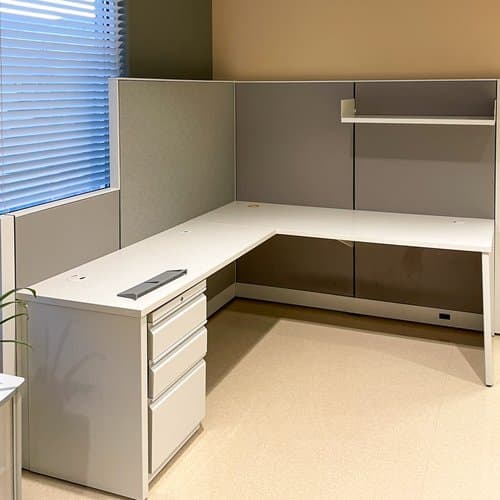 An L-shaped desk with drawers